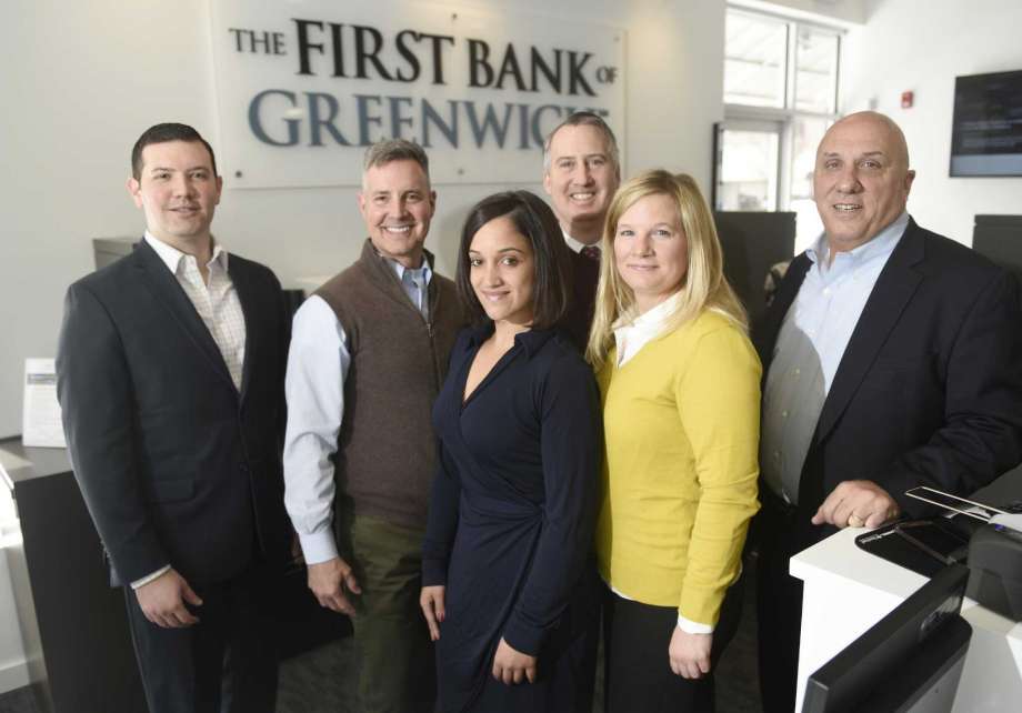 Photo of Chief Lending Officer Evan Corsello, Chief Operating Officer Mark McMillen, Universal Banker Amy Sellers, Branch Manager Stephen Tedesco, Assistant Vice President Emily Newcamp and President and CEO Frank Gaudio at the First Bank of Greenwich branch in Stamford.